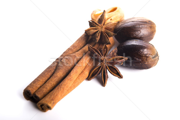 Star anise with cinnamon sticks isolated on white Stock photo © joannawnuk
