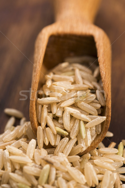 Spoon of brown rice close up Stock photo © joannawnuk