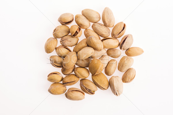 pistachios on white background Stock photo © joannawnuk