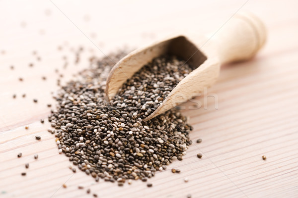 Nutritious chia seeds on a wooden spoon Stock photo © joannawnuk