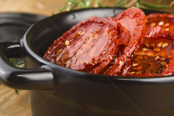 Sun dried tomatoes with olive oil Stock photo © joannawnuk