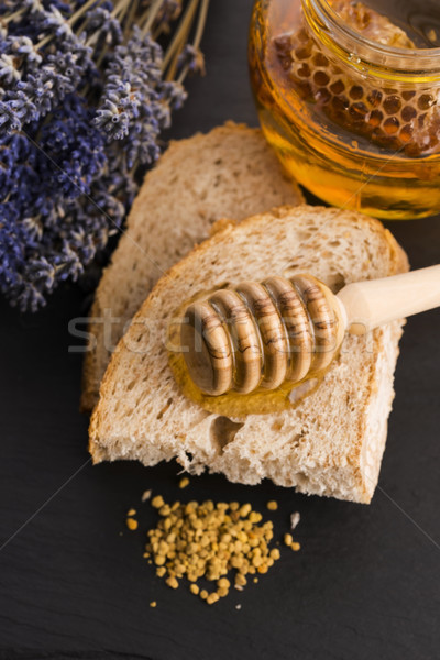 Bread and jar of lavender honey Stock photo © joannawnuk