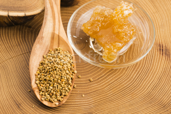 Fresh bee pollen in the spoon with honeycomb Stock photo © joannawnuk
