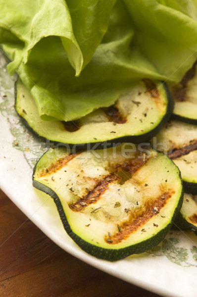 Stock photo: Grilled organic zucchini slices with herbs and spices