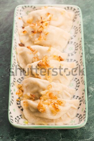 Stock photo: Polish pierogi filled with cabbage and mushrooms