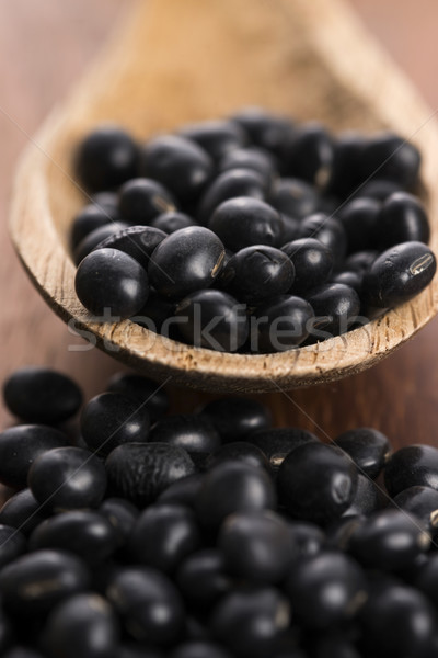 A lot of black soybeans on wooden background Stock photo © joannawnuk