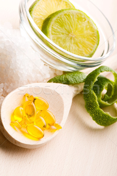 lemon bath - bath salt, capsule and fresh fruits Stock photo © joannawnuk