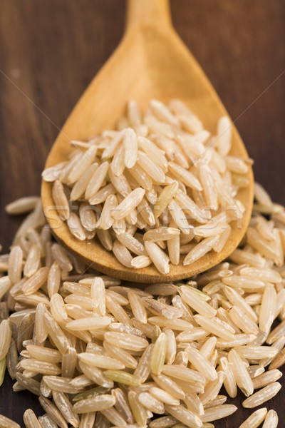 Spoon of brown rice close up Stock photo © joannawnuk