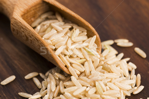 Spoon of brown rice close up Stock photo © joannawnuk