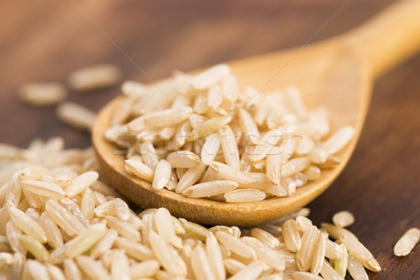 Spoon of brown rice close up Stock photo © joannawnuk