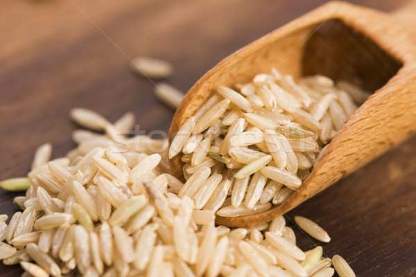 Spoon of brown rice close up Stock photo © joannawnuk