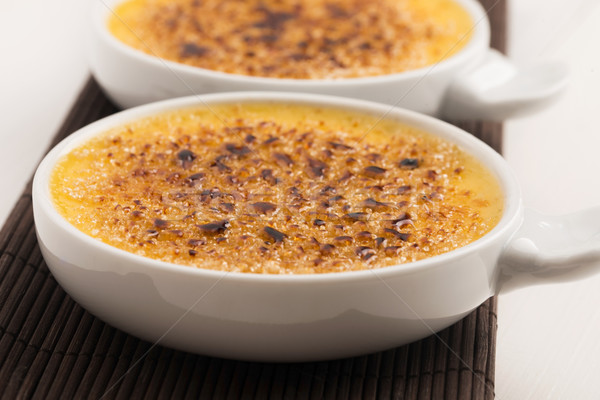 Creme brulee.French vanilla cream dessert with caramelised sugar Stock photo © joannawnuk