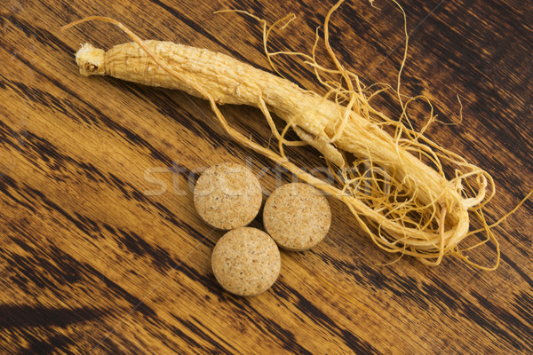 Korean ginseng. Root and pills Stock photo © joannawnuk