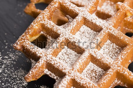 fresh waffles garnished with powdered sugar and raspberries  Stock photo © joannawnuk
