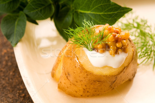 Baked potato with sour cream, grain Dijon mustard and herbs Stock photo © joannawnuk