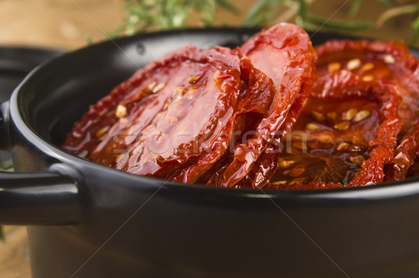 Sun dried tomatoes with olive oil Stock photo © joannawnuk