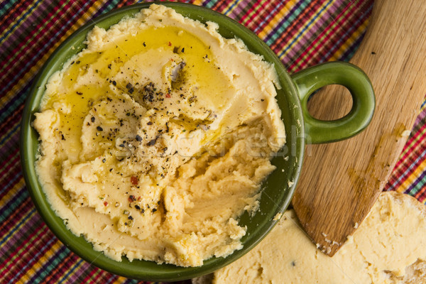 A bowl of creamy hummus Stock photo © joannawnuk