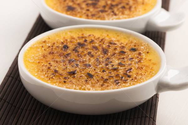 Creme brulee.French vanilla cream dessert with caramelised sugar Stock photo © joannawnuk