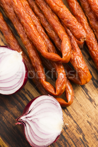 Stock photo: Snack stick sausage with onion