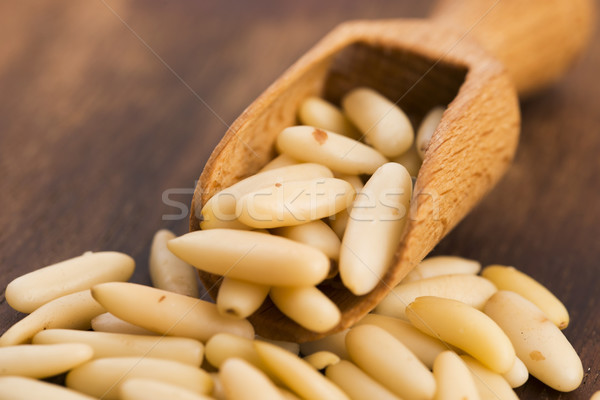 Dry Organic Pine Nuts on Wooden Background Stock photo © joannawnuk