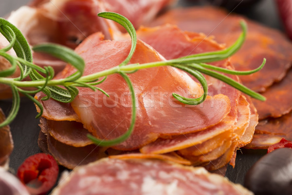 a pile of different spanish embutido, jamon, chorizo and lomo em Stock photo © joannawnuk