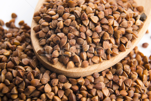 Buckwheat seeds on wooden spoon in closeup  Stock photo © joannawnuk