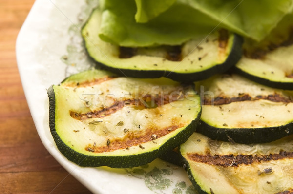 Grilled organic zucchini slices with herbs and spices Stock photo © joannawnuk