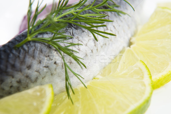 Fillet herring with onion and lemon Stock photo © joannawnuk