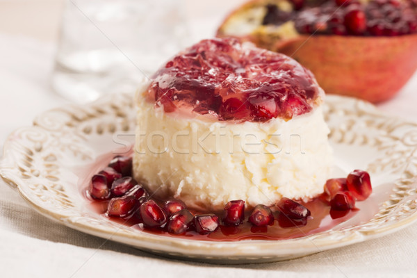 coconut panna cotta dessert with pomegranate Stock photo © joannawnuk