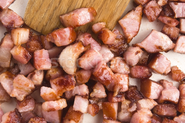 Macro photo of bacon being fried in a pan Stock photo © joannawnuk