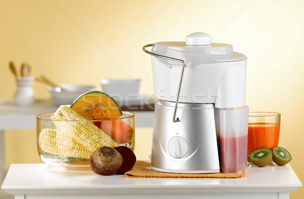 Makes variety fruits juice by maker blender machine in the kitch Stock photo © JohnKasawa