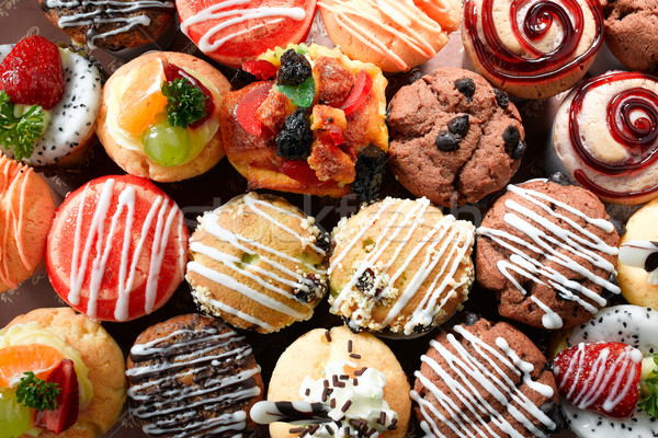 Fancy color of muffins display and variety of topping Stock photo © JohnKasawa