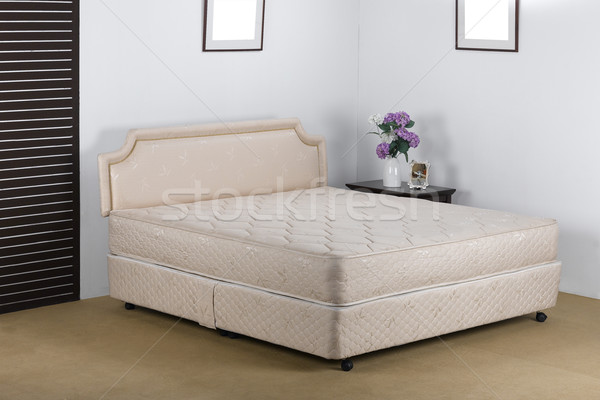 Nice and luxury bedding mattress in a set up bedroom atmosphere Stock photo © JohnKasawa