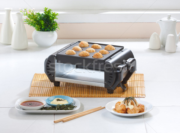 Takoyaki japanese food making machine on the kitchen  Stock photo © JohnKasawa