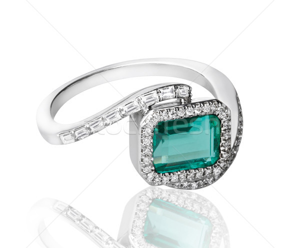 luxury emerald white gold ring surrounding decorates by diamonds Stock photo © JohnKasawa
