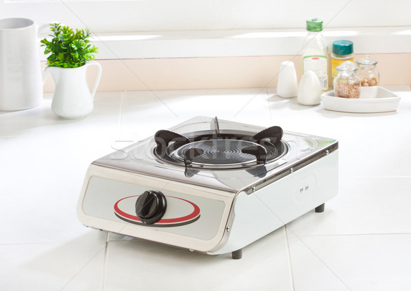 Gas stove with empty gas plate new kitchenware  Stock photo © JohnKasawa