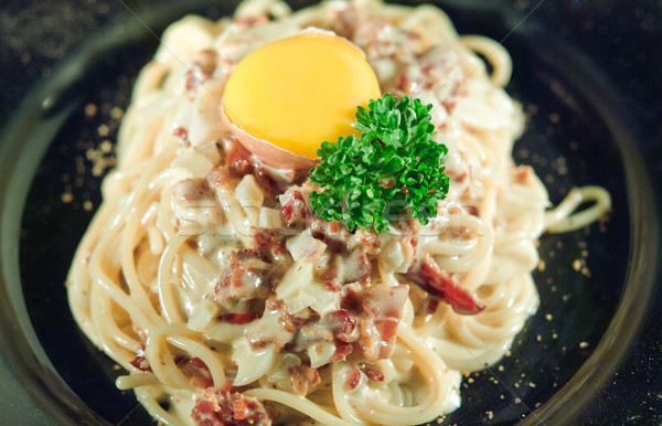 Spaghetti with sauce and bacon Stock photo © JohnKasawa