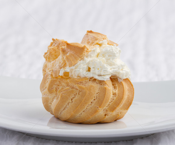 Big eclair appetizer looks eatable with mousse cream on dish  Stock photo © JohnKasawa