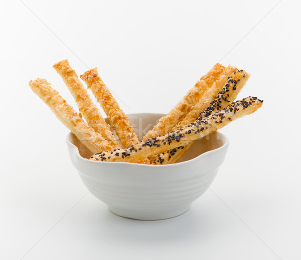 Stock photo: Bread sticks coated with herb and sesame arranges in a bowl 