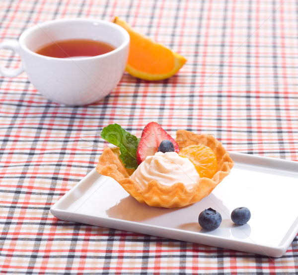 Yogurt cupcake topping with mint and strawberry a great snack Stock photo © JohnKasawa