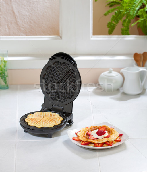 Stock photo: Waffle maker machine in the kitchen 