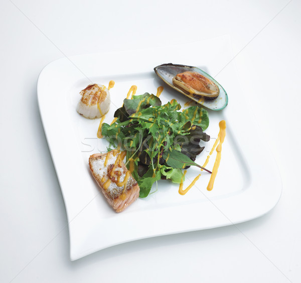 Seafood steak serves with salmon mussel scallops and vegetables  Stock photo © JohnKasawa