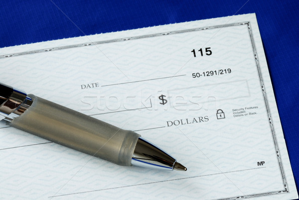 Write the dollar amount on the check isolated on blue Stock photo © johnkwan