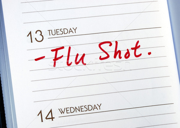 Mark the date on the day planner to have a flu shot Stock photo © johnkwan