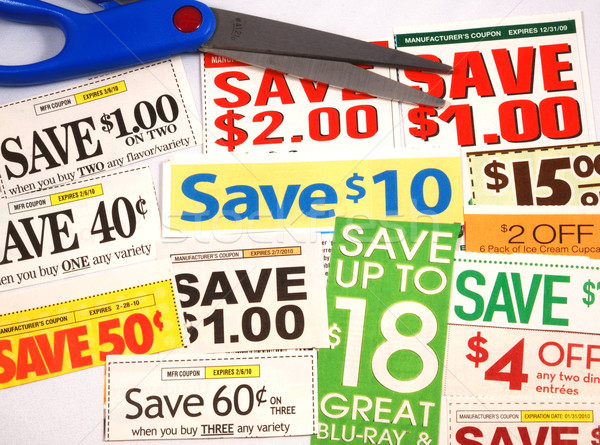 Stock photo: Cut up some coupons to save money 