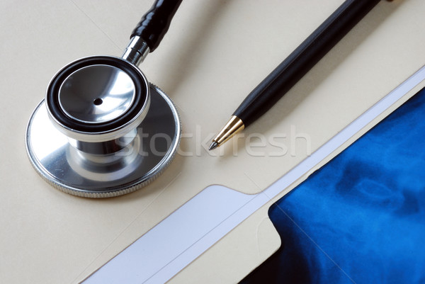 Stock photo: A stethoscope on the top of a medical folder