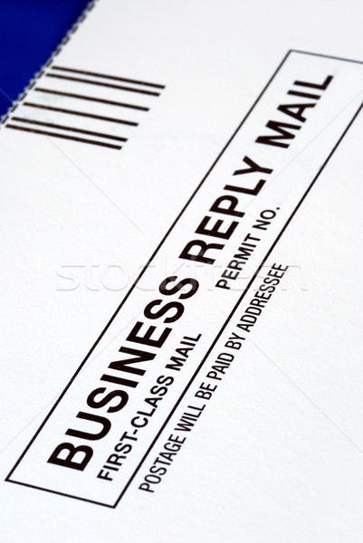 Stock photo: Close-up view of a Business Reply Mail isolated on blue