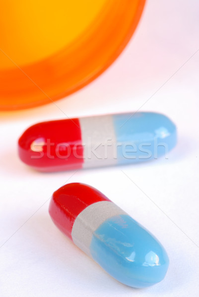 Stock photo: Pour out some medicine from the bottle