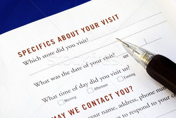 Stock photo: Customer fills in the feedback survey isolated on blue