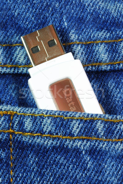 USB flash memory jump drive in a jeans pocket concepts of data mobility Stock photo © johnkwan